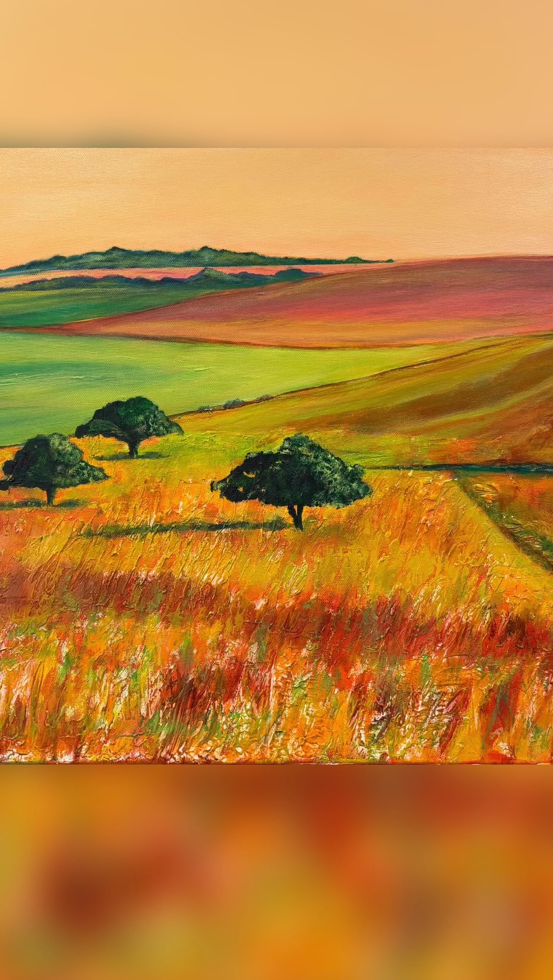 The  brightest lights aren’t  always in the sky… sometimes the glow stays low! 

This painting began with my favourite plaster medium (which adheres well to canvas) - it’s a ‘chalk rich’  ground, resonating with the chalk geology of the Chiltern Ridge beneath. 

Though now clearly agricultural land, the ridges and scrapes embedded in the plaster’s surface lend  authenticity —  bringing to life  traces of centuries of human activity here…

The three iconic scrub trees stand as sentinels of time,  lending life and rhythm to the scene whatever the season. 

This relaxed and captivating painting is alive with vibrant colours. (50x40x4cm) 

#chilterns #buckinghamshireart #uklandscape# landscapeart #landscapepainting